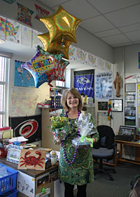 Laurie Huger stands in her classroom on the day she was notified that she was selected as the recipient of the 2019 Monsignor Lewis Award for Excellence in Teaching.