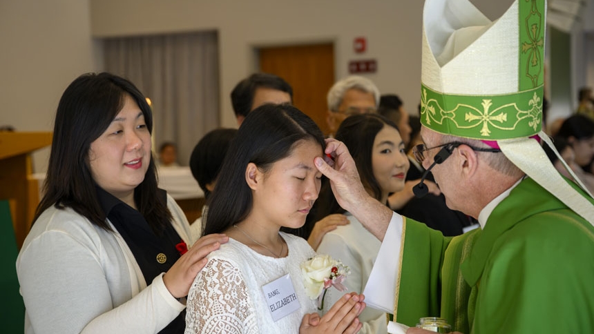 Bishop confirms 26 at St. Ha Sang Paul Jung