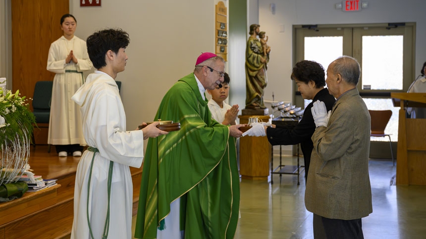 Bishop confirms 26 at St. Ha Sang Paul Jung